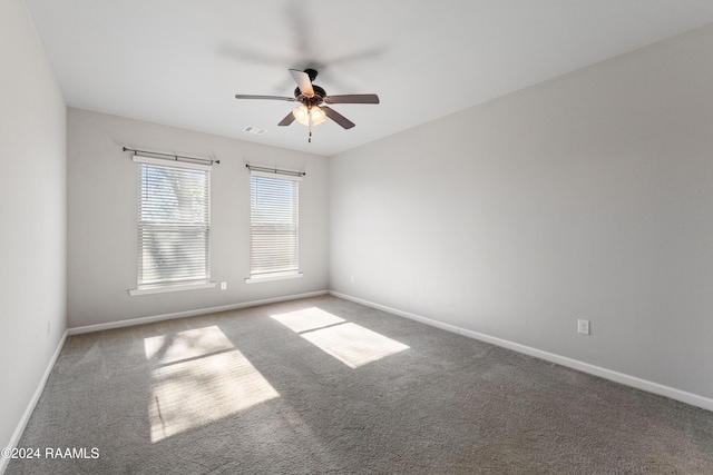 unfurnished room with carpet and ceiling fan