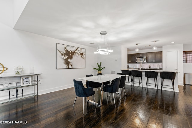 dining area with dark hardwood / wood-style flooring