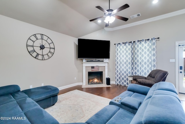 living room featuring hardwood / wood-style floors, vaulted ceiling, ceiling fan, and crown molding