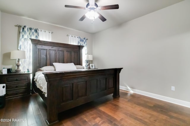 bedroom featuring ceiling fan and dark wood-type flooring