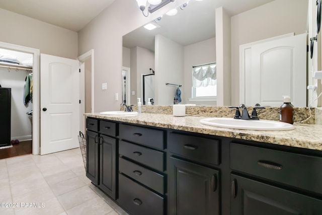 bathroom with tile patterned flooring and vanity