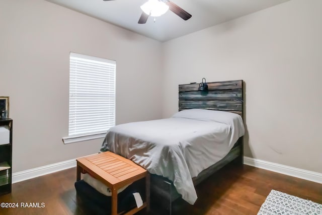 bedroom featuring ceiling fan and dark wood-type flooring