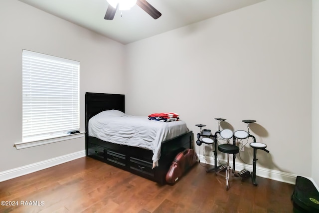 bedroom with hardwood / wood-style floors and ceiling fan