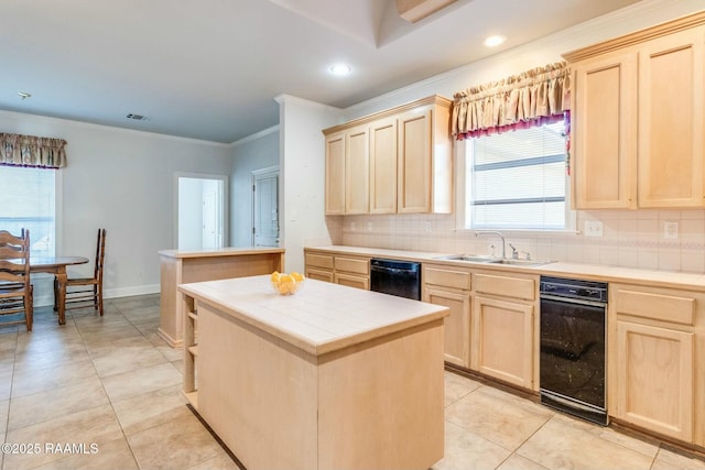 kitchen with light brown cabinetry, sink, a kitchen island, tile counters, and light tile patterned flooring