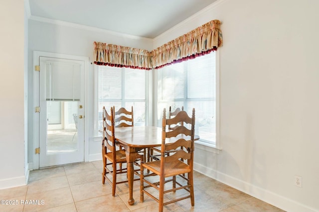 tiled dining area featuring crown molding