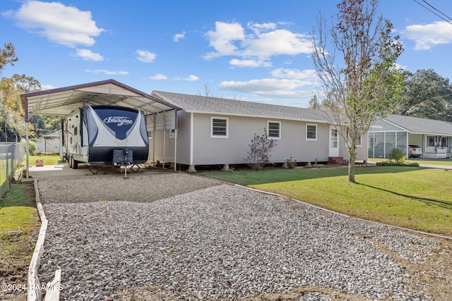 903 S Shireview Cir, Abbeville, LA 70510 - view of front of property with driveway, a carport, and a shingled roof