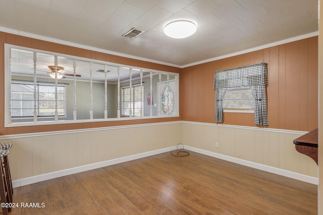 903 S Shireview Cir, Abbeville, LA 70510 - spare room featuring wood finished floors, ornamental molding, and a ceiling fan