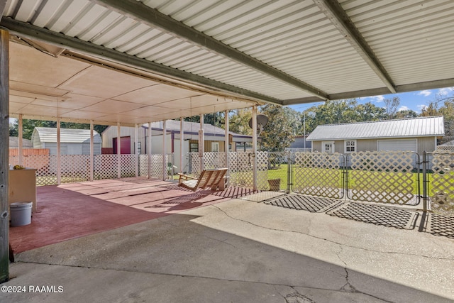 903 S Shireview Cir, Abbeville, LA 70510 - view of patio featuring an outdoor structure and a gate