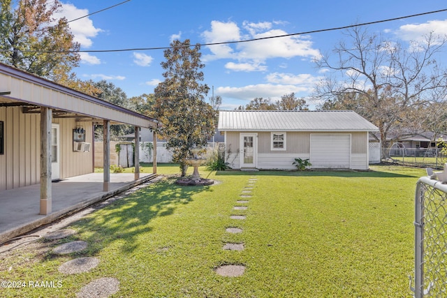 903 S Shireview Cir, Abbeville, LA 70510 - view of front of house featuring a patio area, a metal roof, a fenced backyard, and an outbuilding