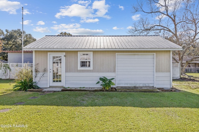 903 S Shireview Cir, Abbeville, LA 70510 - view of front facade featuring a metal roof, an outdoor structure, and a garage