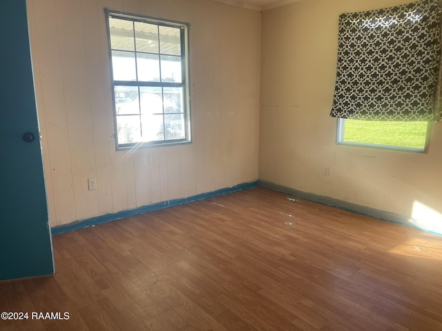 empty room with dark hardwood / wood-style floors