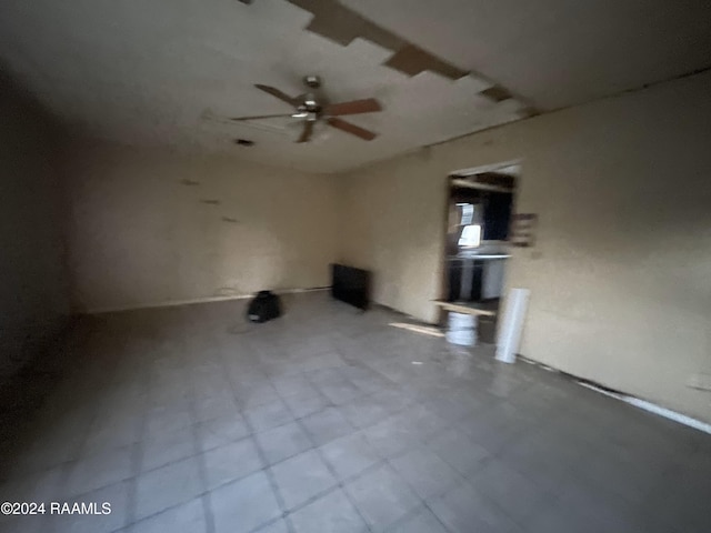 interior space featuring ceiling fan