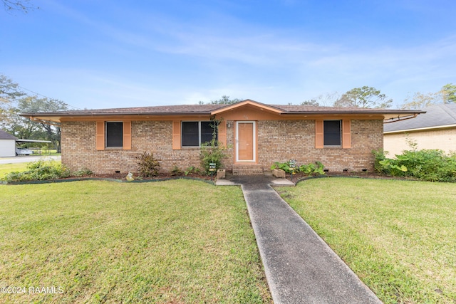 single story home featuring a front yard