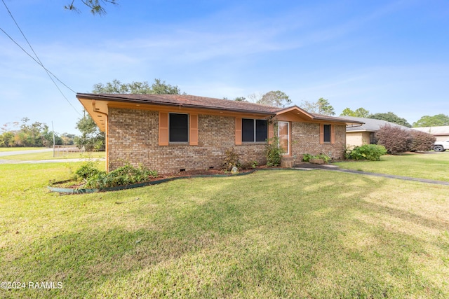 ranch-style house with a front yard