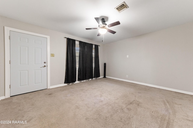 spare room with ceiling fan and carpet floors