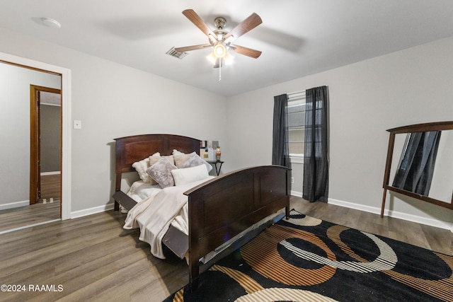 bedroom featuring hardwood / wood-style flooring and ceiling fan