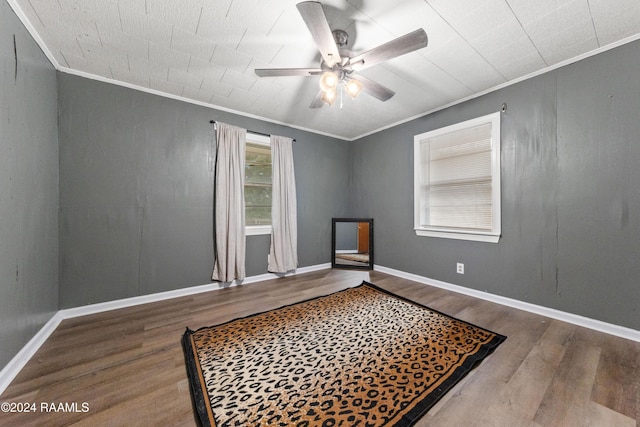 spare room featuring ceiling fan, ornamental molding, and hardwood / wood-style flooring