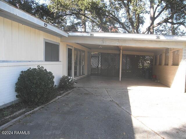 view of parking / parking lot with a carport