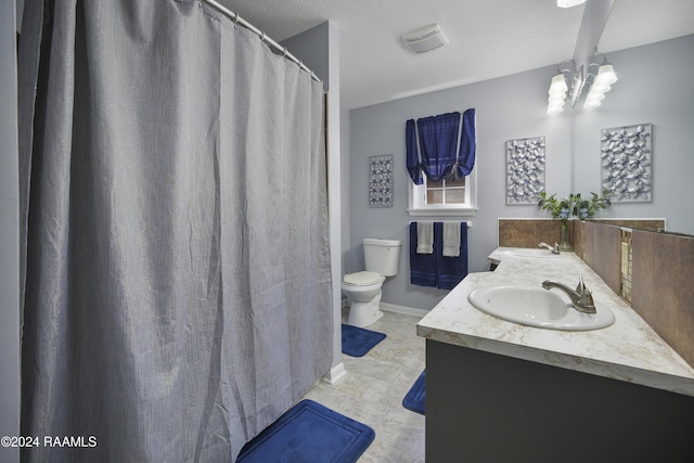 bathroom featuring vanity, toilet, a textured ceiling, and an inviting chandelier