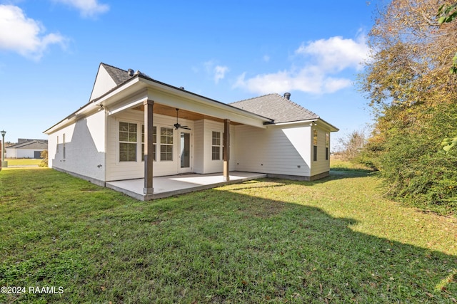 rear view of house with a lawn, ceiling fan, and a patio