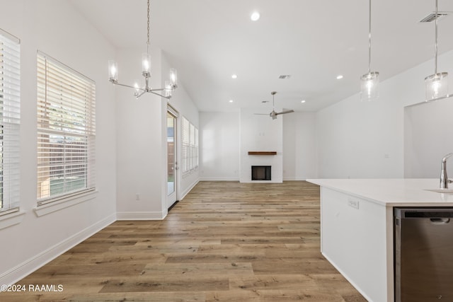 400 Croft, Lafayette, LA 70503 - unfurnished living room featuring a fireplace, ceiling fan, a chandelier, light wood-type flooring, and recessed lighting