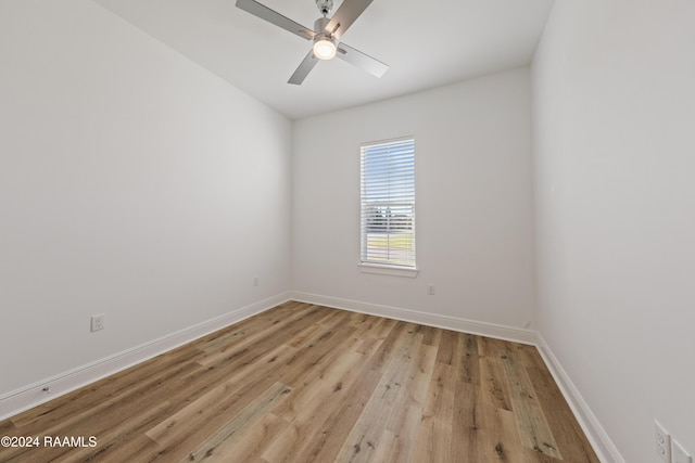 spare room featuring ceiling fan and light wood-type flooring