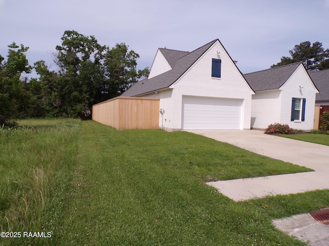 400 Croft, Lafayette, LA 70503 - view of front of house featuring an attached garage, concrete driveway, a front lawn, and roof with shingles
