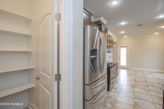 kitchen featuring light tile patterned floors, crown molding, and appliances with stainless steel finishes