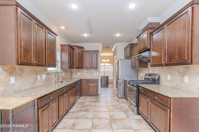 kitchen featuring tasteful backsplash, stainless steel gas range oven, sink, and crown molding