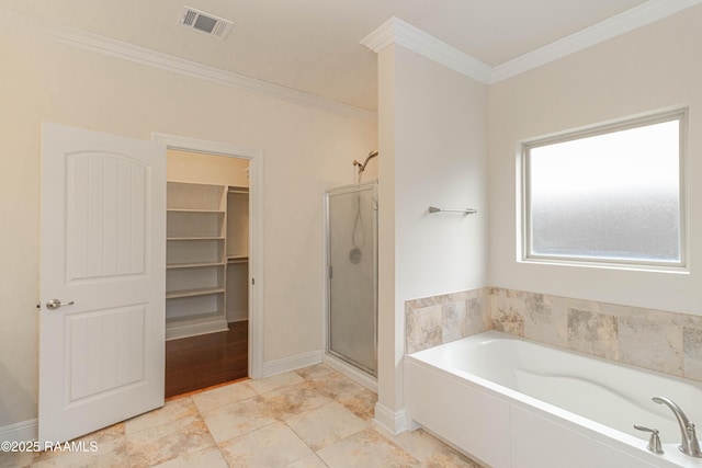 bathroom with ornamental molding and independent shower and bath