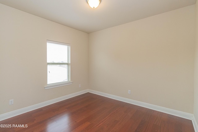 empty room with dark hardwood / wood-style floors