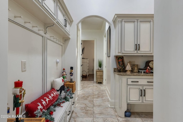 mudroom with light tile patterned floors