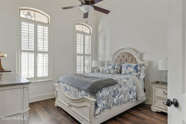 bedroom featuring ceiling fan and dark hardwood / wood-style flooring