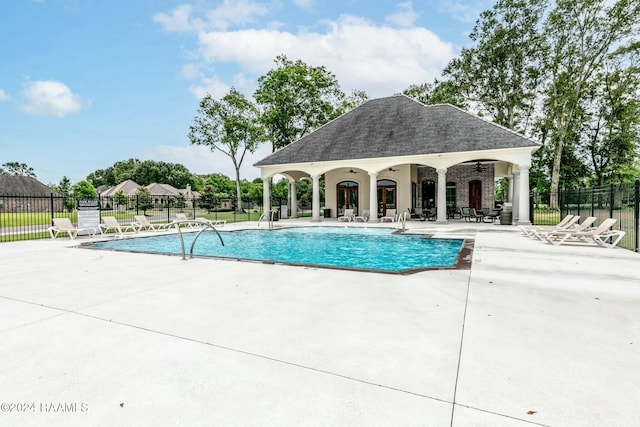 view of pool with a patio area and an outdoor structure