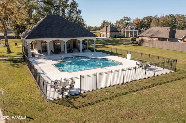 view of swimming pool with a lawn and a patio