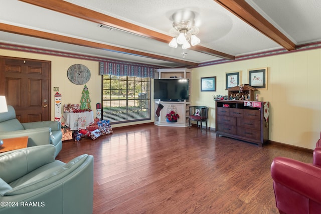 living room with beamed ceiling, a textured ceiling, dark hardwood / wood-style flooring, and ceiling fan