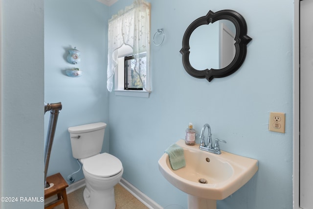 bathroom with tile patterned floors, sink, and toilet