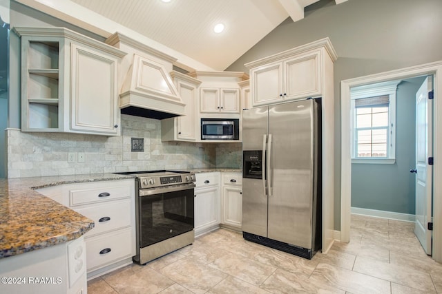 kitchen featuring light stone countertops, tasteful backsplash, lofted ceiling with beams, premium range hood, and appliances with stainless steel finishes