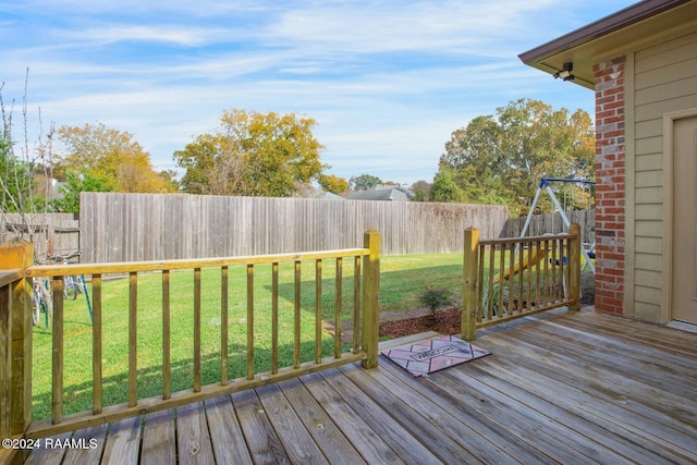 wooden terrace with a yard