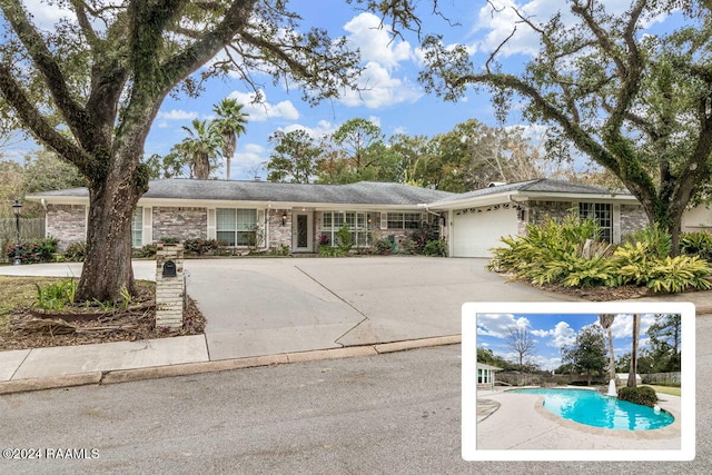 ranch-style home featuring a garage