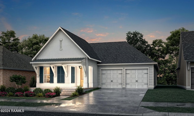 view of front facade with a porch, concrete driveway, a standing seam roof, metal roof, and a garage