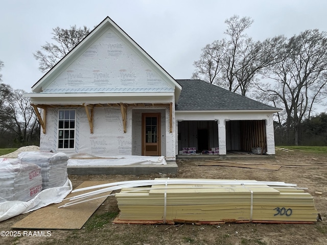 view of front facade featuring a shingled roof