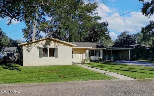 single story home featuring a front lawn and a carport