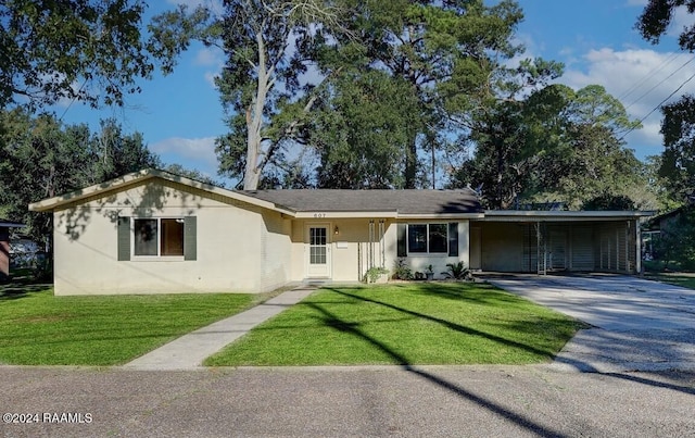 ranch-style home with a front lawn and a carport