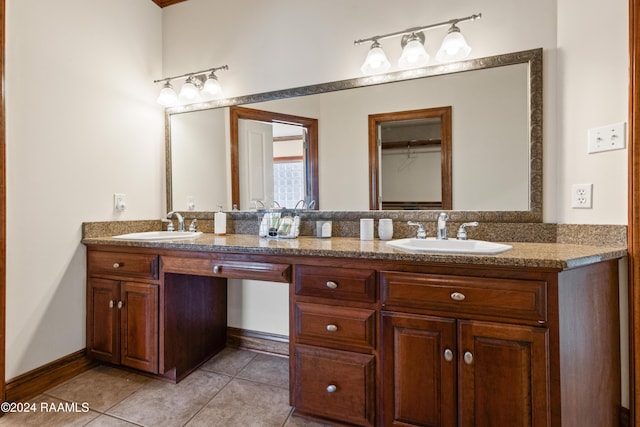 bathroom with tile patterned floors and vanity