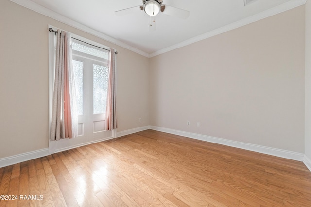 spare room featuring ceiling fan, light hardwood / wood-style flooring, and ornamental molding