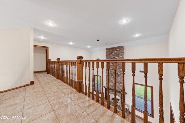 hallway featuring light tile patterned flooring