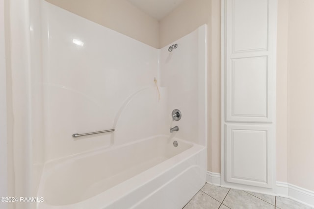 bathroom with tile patterned flooring and  shower combination