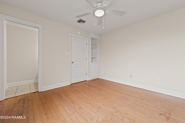 unfurnished bedroom featuring ceiling fan and light hardwood / wood-style floors