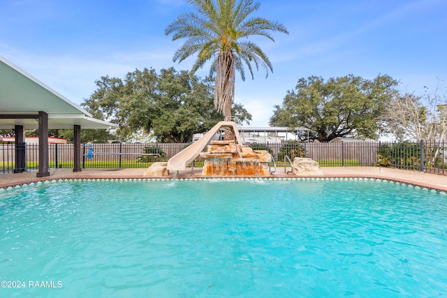 view of swimming pool featuring a water slide